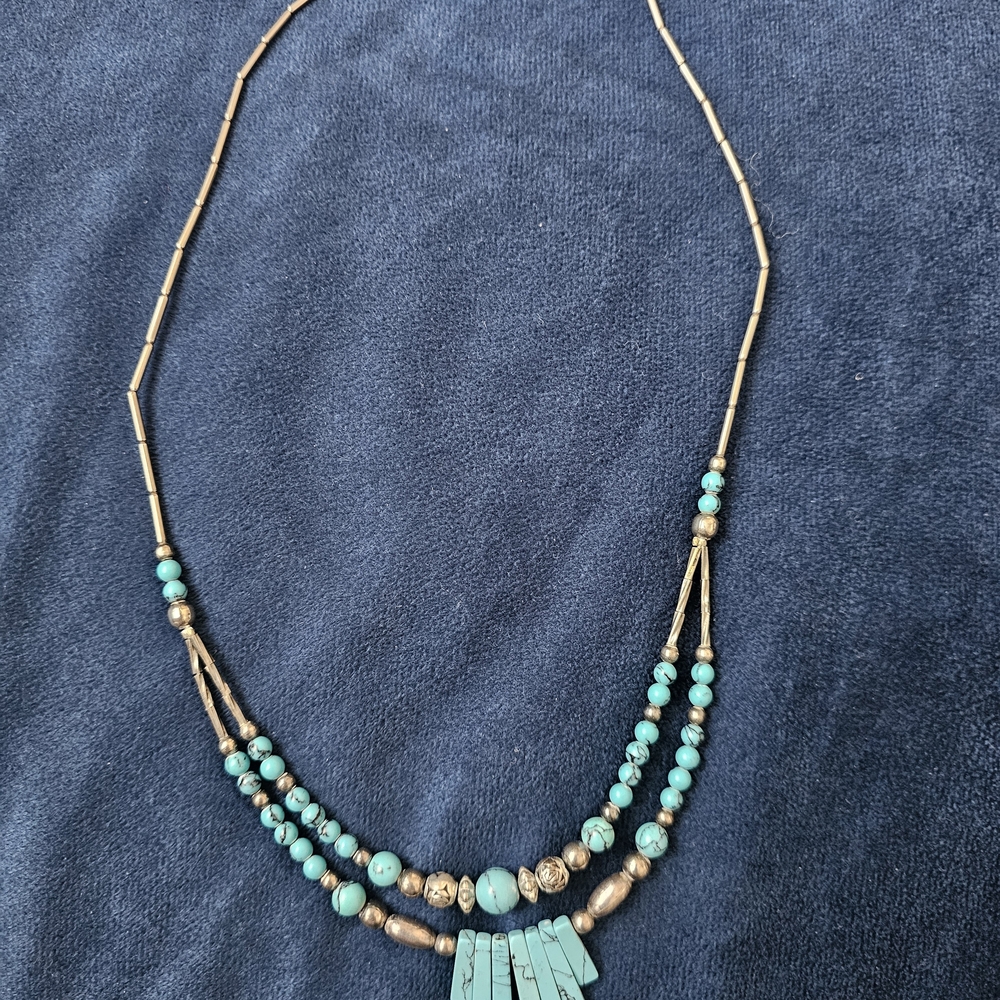 Southwest/Native American-style double-strand piece featuring turquoise-colored